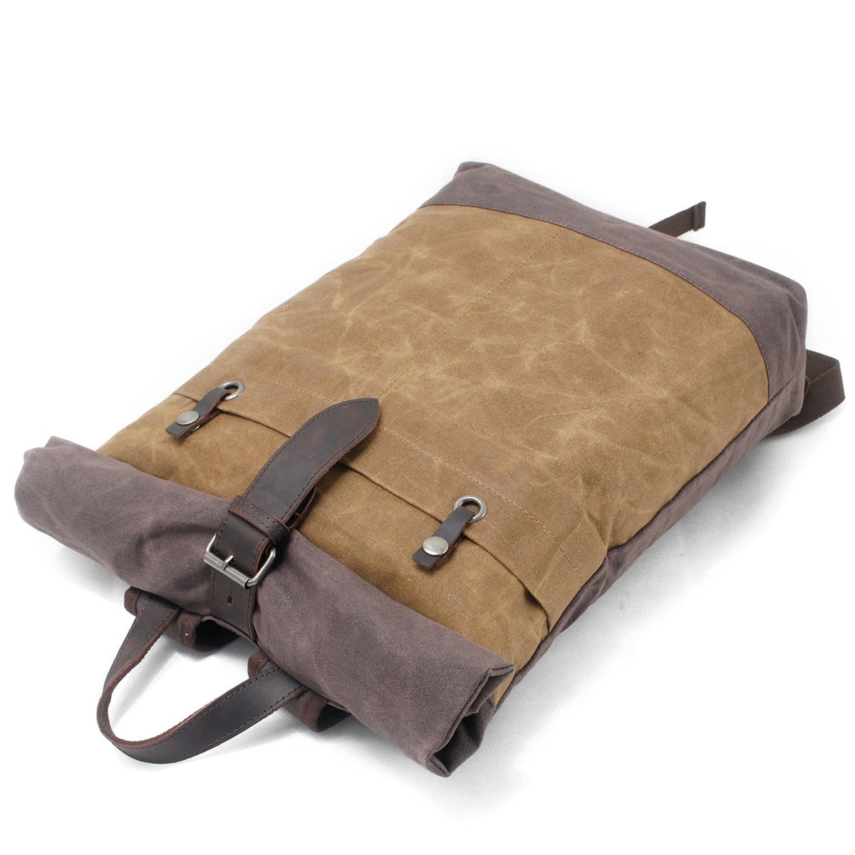 Khaki roll top backpack lying flat with the strap fastened