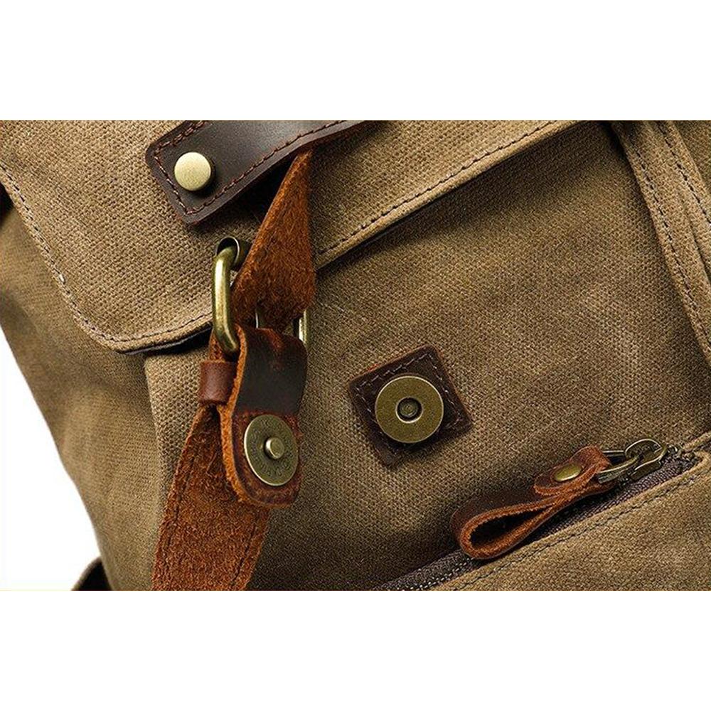 Brass magnetic snap and zipper pull on the khaki rucksack