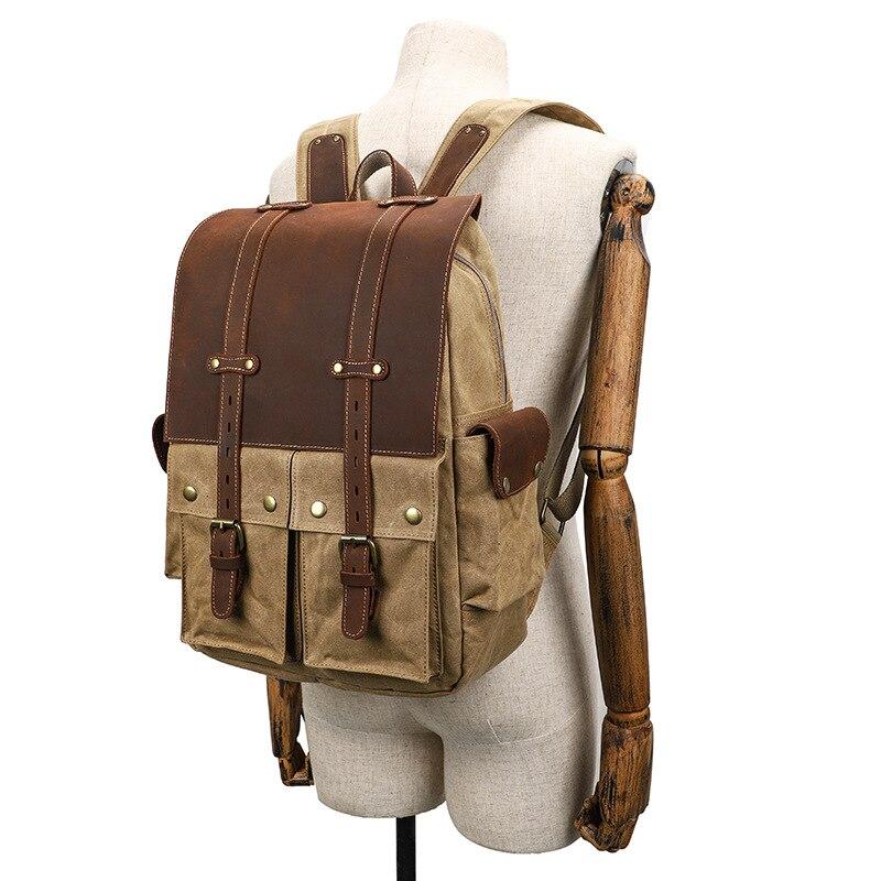 Waxed canvas camera backpack worn on a mannequin to show its size