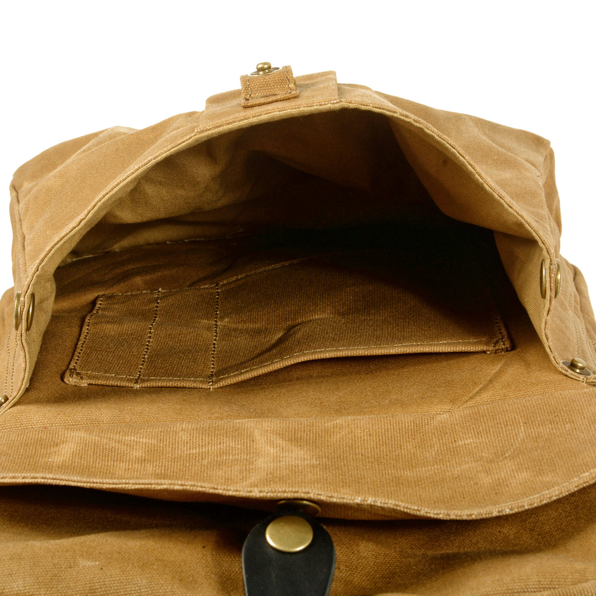 Inside the front flap pocket of the khaki canvas backpack