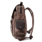 Right side of coffee waxed canvas backpack with leather flap pocket and padded shoulder straps.