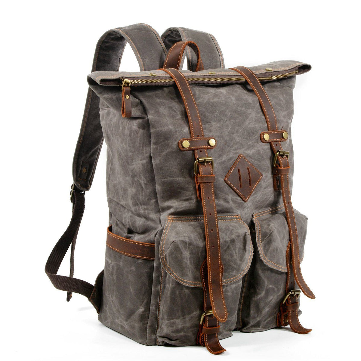 Gray waxed canvas backpack at an angle with rolled top, leather straps and side pocket visible.