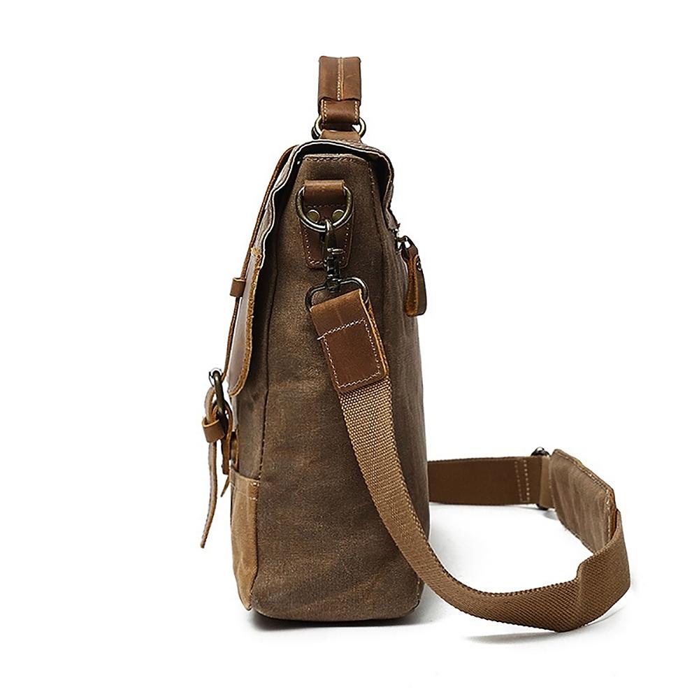 Side profile showing the strap clip, attachment ring and depth of the messenger bag