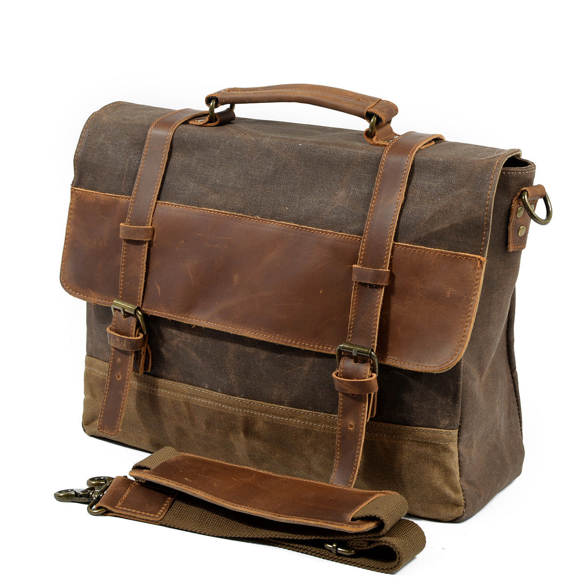Canvas messenger bag standing beside its detached shoulder strap
