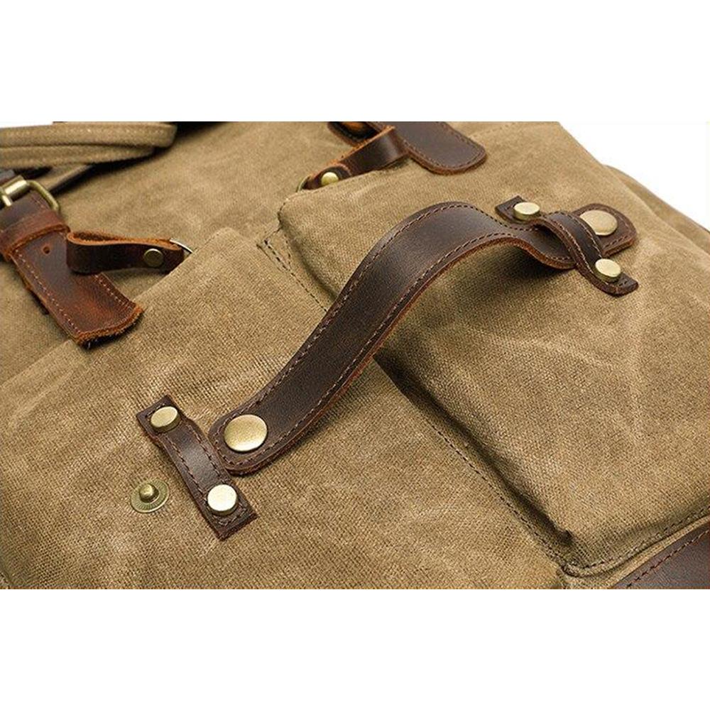 Riveted leather tab and brass rivets on the khaki canvas pocket
