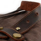 Leather strap tab with brass rivets on Coffee waxed canvas.