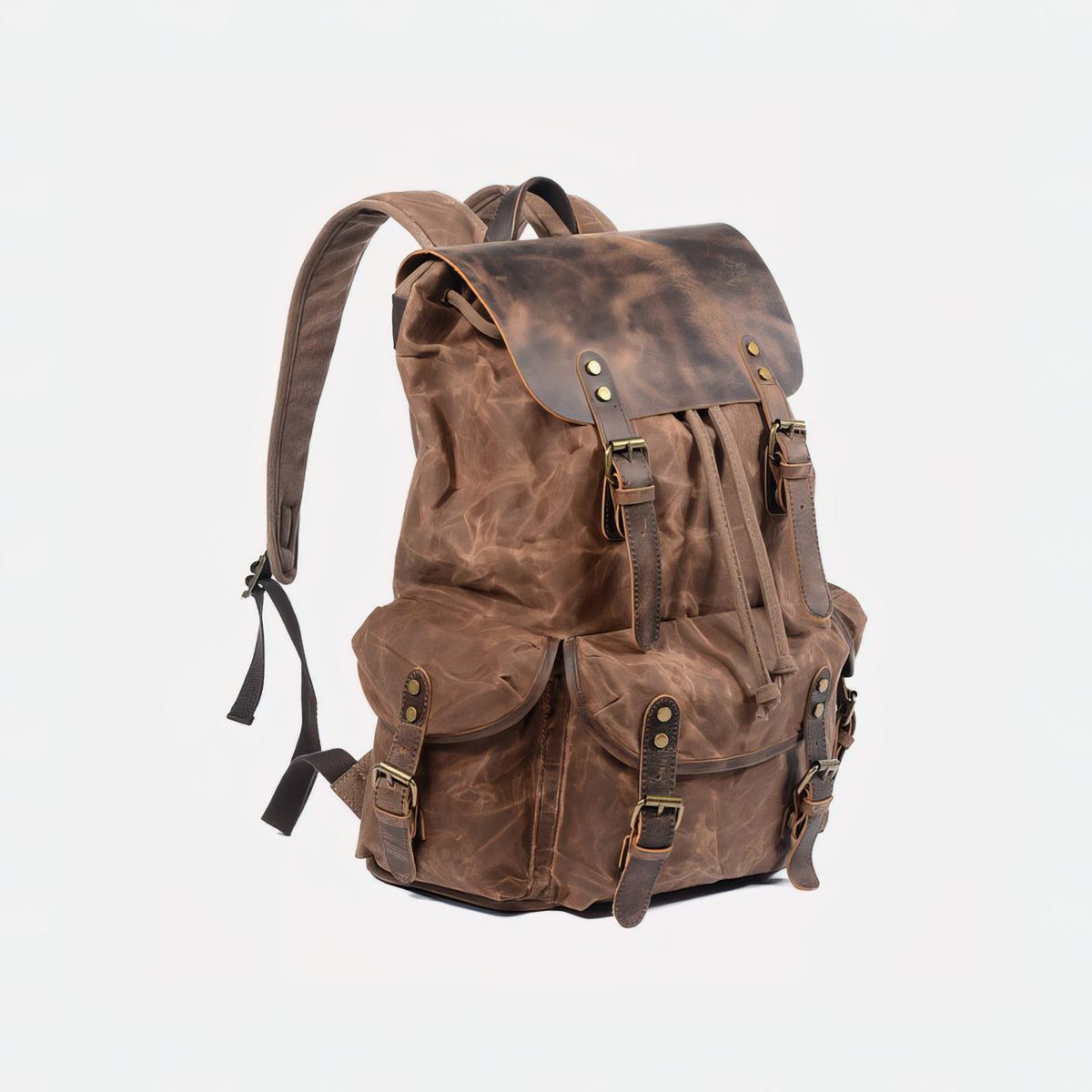 Coffee waxed canvas backpack at an angle, showing side flap pocket and leather fastening straps.
