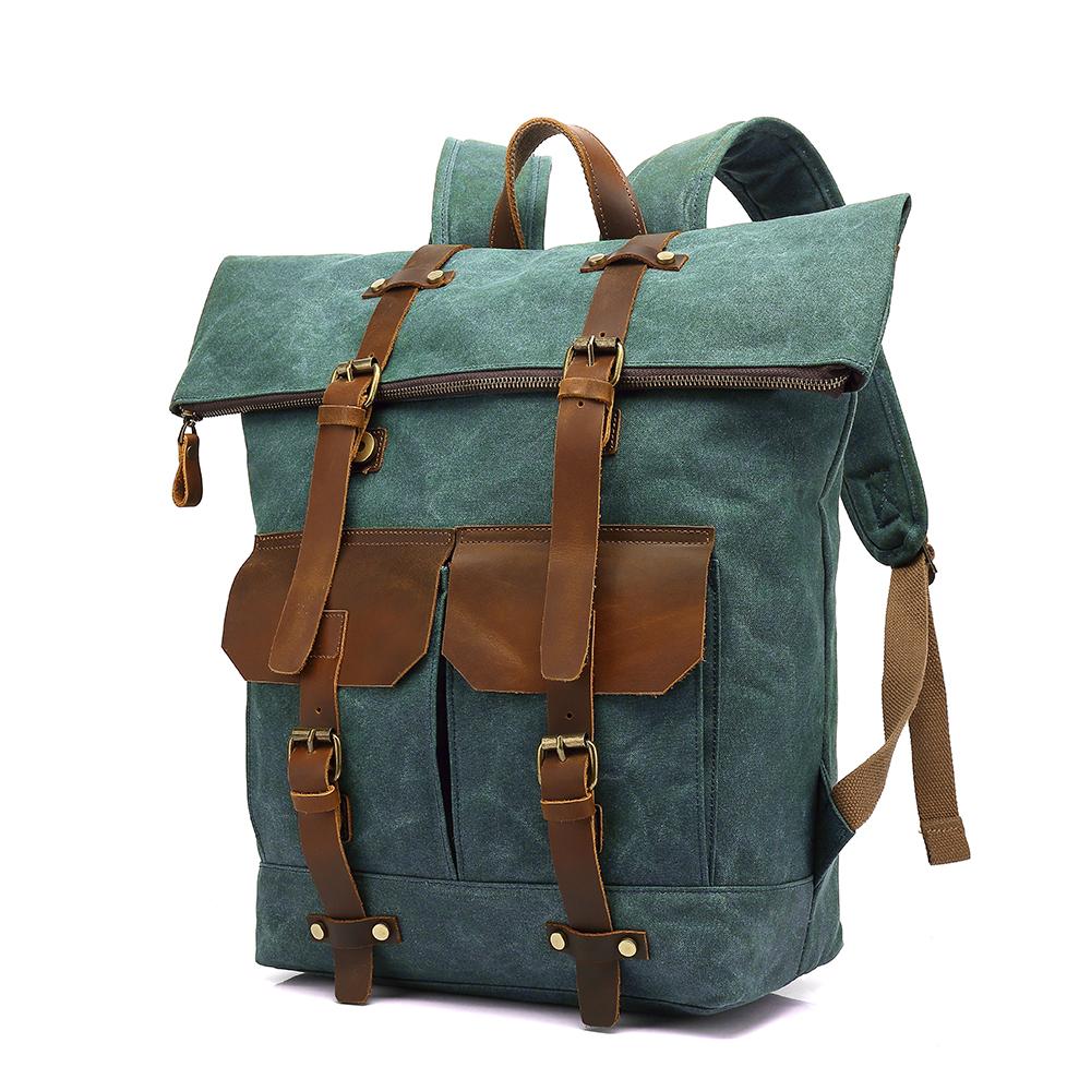 Three-quarter view of the roll top backpack in lake green