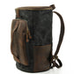 Three-quarter view of the black waxed canvas backpack showing the front pocket depth and side storage