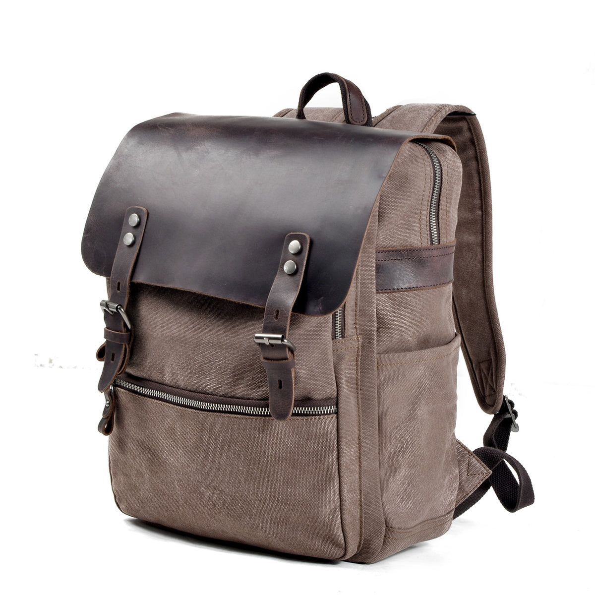 Three-quarter front view of the brown canvas backpack showing its body and leather straps