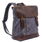 Three-quarter view of the gray school backpack with a dark leather flap