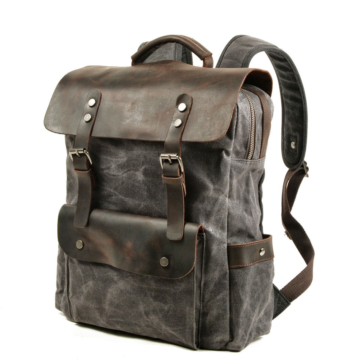 Three-quarter view of the Gray backpack with its padded shoulder strap and leather front pocket.
