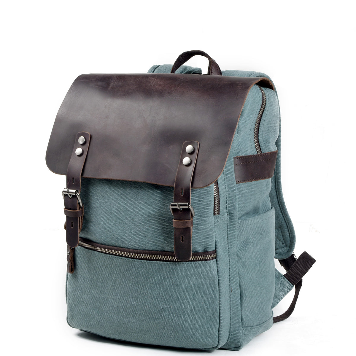 Three-quarter view of the lake green canvas backpack showing its leather flap and adjustable straps